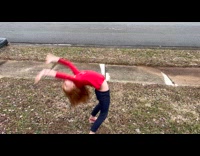 Girl copies the position of the snowman