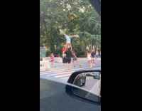 Four people acrobatics on the pedestrian lane