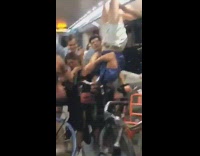 two bikers play patty cake upside down on subway