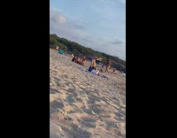 Woman upside down on man legs beach part 2