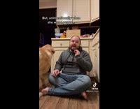 Guy sings silent night to his dog
