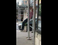 Pt. 2 Guy red white striped shirt does pull ups on metal bar on building frame