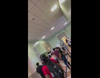 Man in bright green shirt yelling at dmv