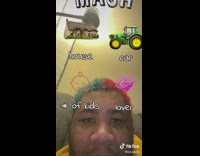 Guy yellow shirt blue and red hair playing MASH filter