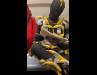 Man black bodysuit with taped bananas subway