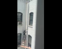 Man climb ladder on plank lean on wall