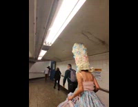 Lady dressed as Queen Charlotte on subway