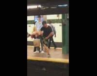 Guy does a sexy strip tease dance in subway station, dances on woman in yellow shirt