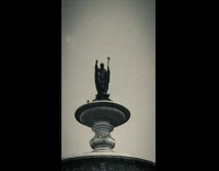 Doves Glide Down and Rest on Fountain