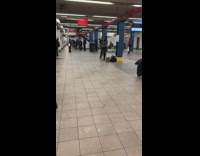 Guy in subway station tap dancing as performance 

