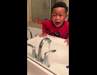 Little boy red shirt screaming lost tooth bleeding