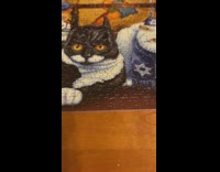 Guy finishes completes cat jigsaw puzzle 