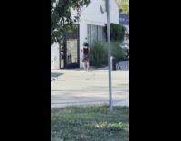 Man in black tank top dances and films his feet