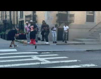 Collab winy - Men performs for video shoot on sidewalk