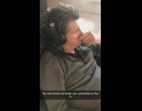Dad thinks beats headphones connected to television 