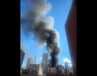 Large smoke from fire on building rooftop part 2