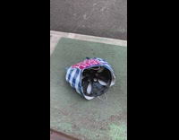 Dropped shopping bag with car rim inside 