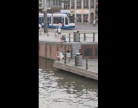 Girl denim jacket sit ledge water train