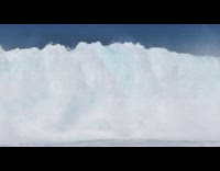Guy on surfboard at top of wave falls
