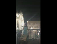 Two woman dress wine glass cathedral nighttime