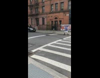 Blue shirt guy plays tennis alone street