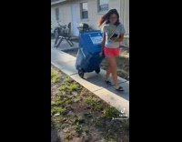 Girl taking man for walk blue trash can 