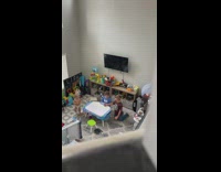 Baby throws box at oldest child unbothered