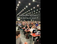 ClipsIG - Blonde Man Shows Many Students Take Exam in Warehouse