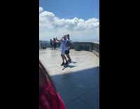Two guys dance christ the redeemer statue