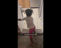 Girl sings its a hard knock life while mopping floor