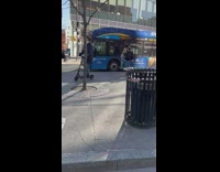 Collab WINY - Guy in black hoodie and blue jeans carries skeleton 