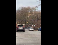 Black car drifts in middle of road