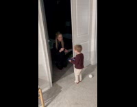 Toddler gets stamp and enters party room