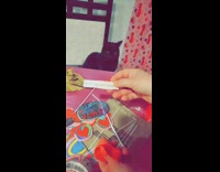 Girls read valentines day fortune black cat 