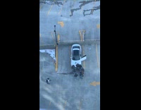 Guys film on rooftop parking lot