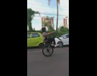 Guy blue bicycle wheelie no front tire