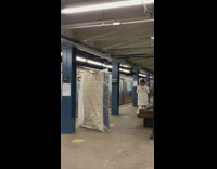 Collab Subway_Creatures - Guy brings mattress in plastic onto subway