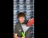 Guy Pours Drink into Funnel and Drinks from Tube 