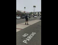 guy on rollerblades with surfboard 