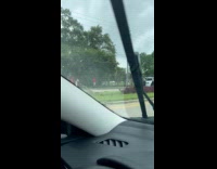 Red Camaro car drives through the fence