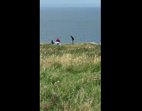 White shirt guy music video hill ocean 