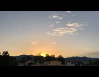 Sunrise time lapse rooftop india houses mountain