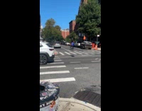 Man biking while balance tire on head