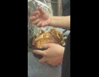 Woman picks at rotisserie chicken with her bare hands and feed it to baby in stroller on the subway #BluePointWhatTheL