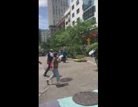 Spiderman sings in front of bank 