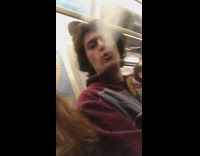 Guy Lights Cigarette on Subway Train