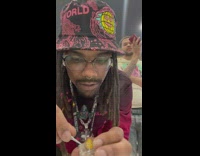 Guy smokes from bong on repeat 