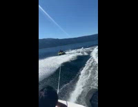 Guy rides raft hits bump flies off