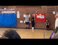 Teacher dives for ball rolled on floor