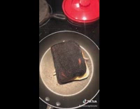 Guy flips sandwich other side is burnt 